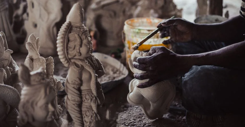 Parvati sculpting clay,